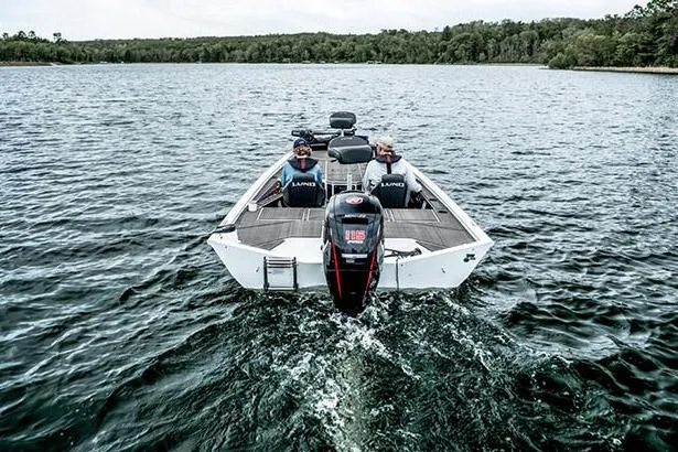 Slide: The Image of Manufacturer Provided Image: 2025 Lund 1875 Renegade boat cruising on a lake with two passengers. - 4