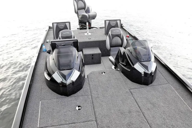 Slide: The Image of Manufacturer Provided Image: 2025 Lund 1875 Renegade boat interior with dual consoles and seating on the water. - 5