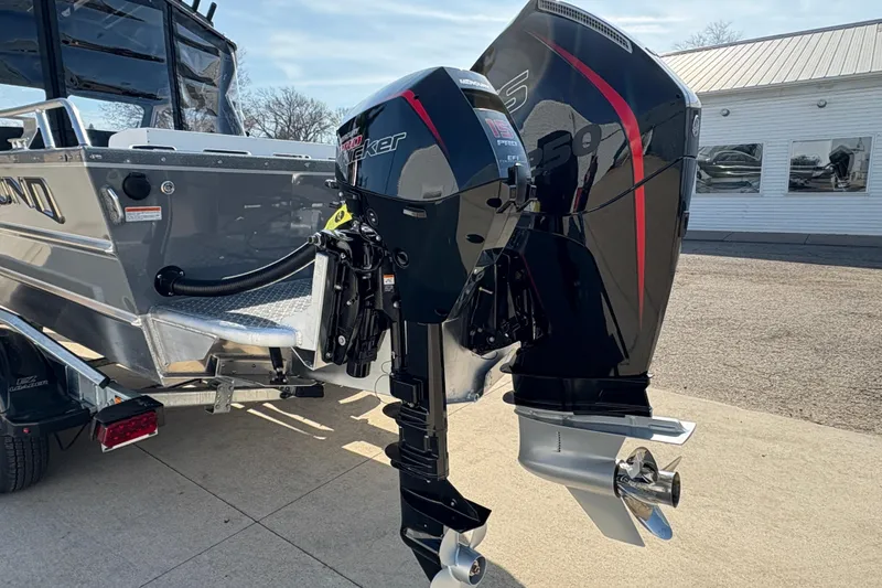 Slide: The Image of 2026 Lund 210 Heavy Gauge boat with dual Mercury outboard motors. - 12