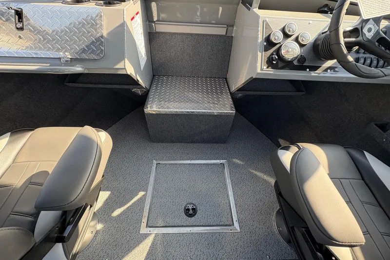 Slide: The Image of Interior of 2026 Lund 210 Heavy Gauge boat with seating and control panel. - 25