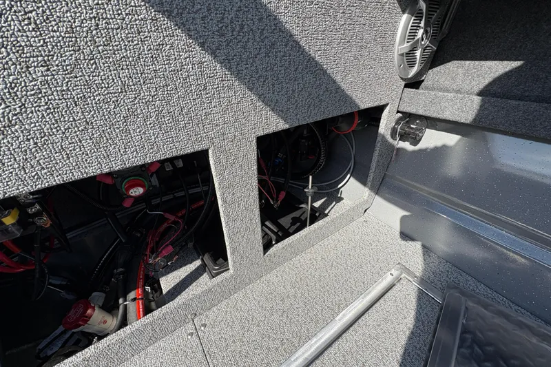 Slide: The Image of Interior view of 2026 Lund 210 Heavy Gauge boat showing wiring and components. - 43