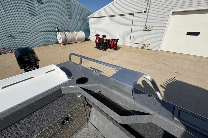 Slide: The Image of 2026 Lund 210 Heavy Gauge boat, docked outdoors, showcasing sleek design and sturdy construction. - 45