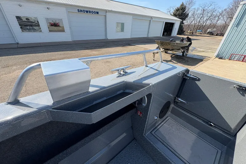 Slide: The Image of 2026 Lund 210 Heavy Gauge boat interior near showroom, showcasing sleek design and features. - 46