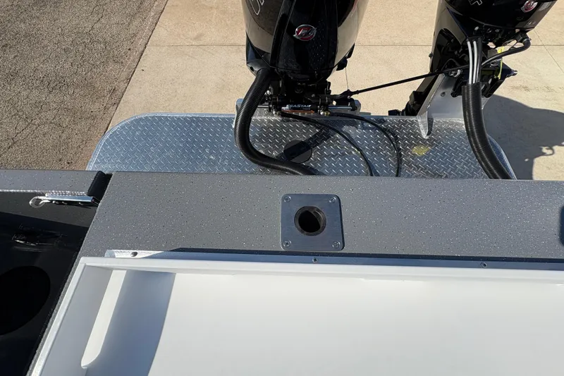 Slide: The Image of 2026 Lund 210 Heavy Gauge boat with dual outboard motors on diamond plate platform. - 51