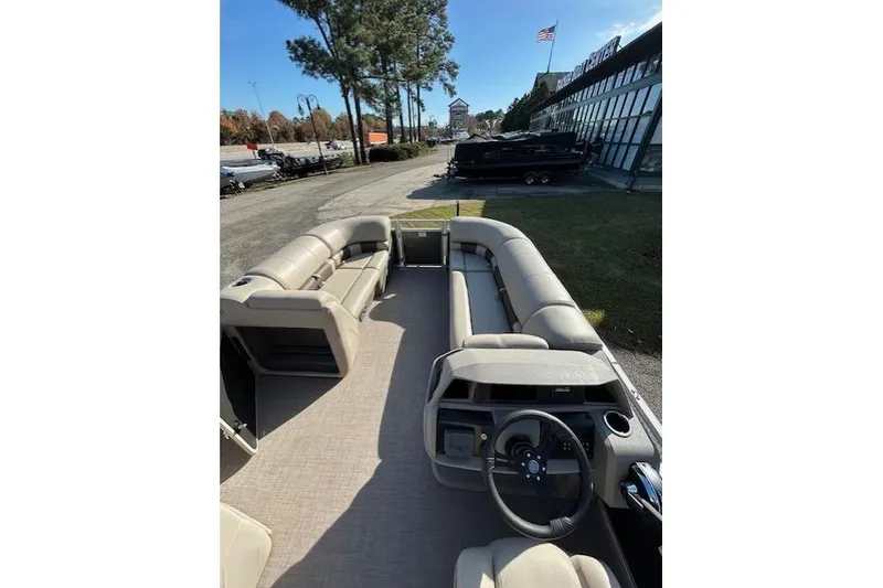 Slide: The Image of 2025 Sun Tracker Party Barge 20 DLX pontoon boat with spacious seating and modern design. - 7