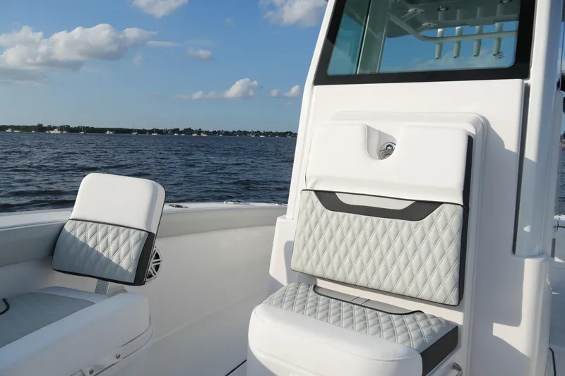 Slide: The Image of 2026 Blackfin 262 HB boat interior with diamond-stitched seating on a sunny day. - 44