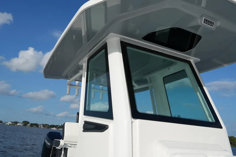 Slide: The Image of 2026 Blackfin 262 HB boat with sleek design on a sunny day. - 45