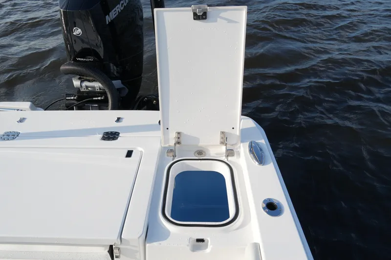 Slide: The Image of 2026 Blackfin 262 HB boat with open hatch and Mercury Verado engine on water. - 51