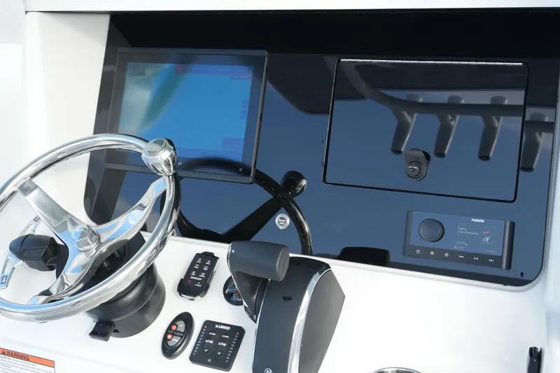 Slide: The Image of 2026 Blackfin 262 HB helm with modern controls and touchscreen display. - 54