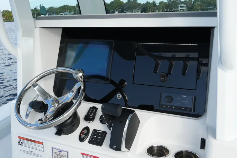 Slide: The Image of 2026 Blackfin 262 HB boat dashboard with steering wheel and control panel. - 55