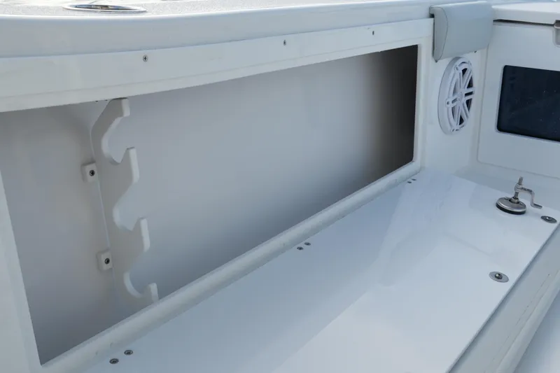 Slide: The Image of Interior view of 2026 Blackfin 262 HB boat storage compartment and speaker. - 65