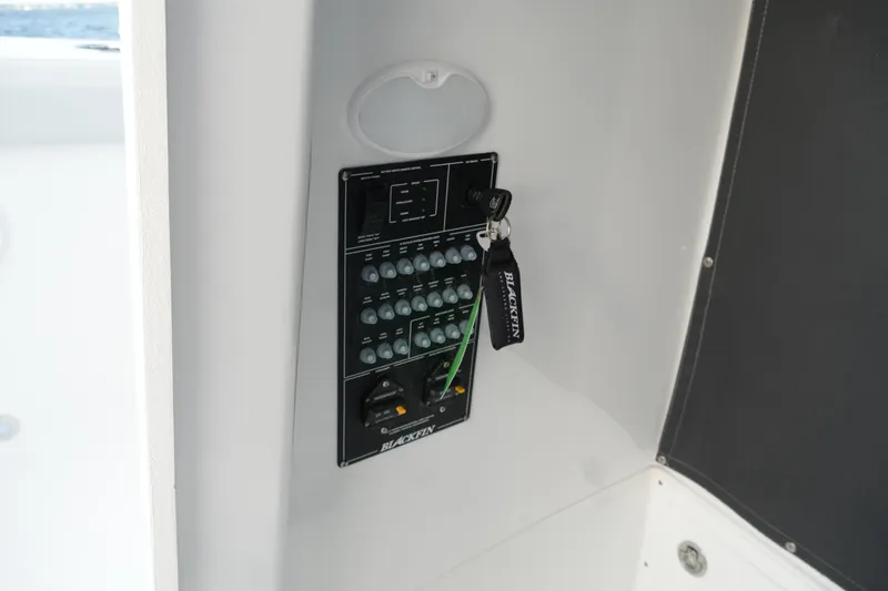 Slide: The Image of Control panel of 2026 Blackfin 262 HB boat with key and switches. - 66