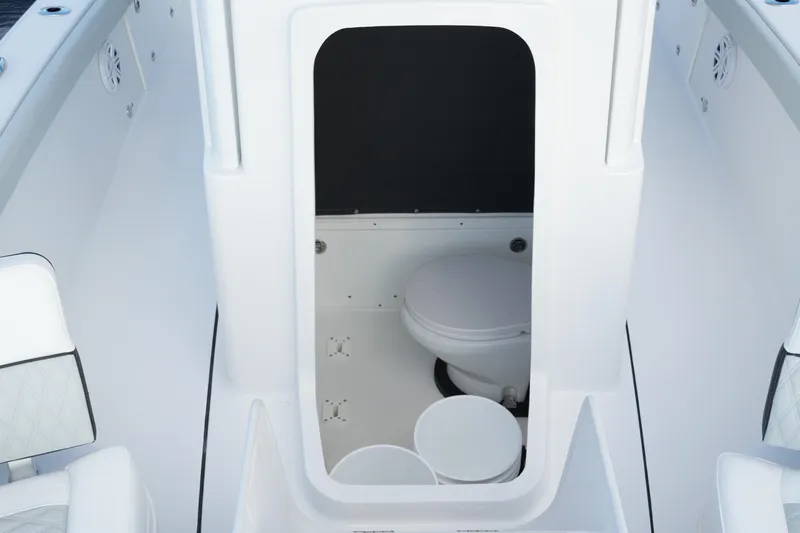 Slide: The Image of 2026 Blackfin 262 HB boat interior with compact marine toilet. - 67