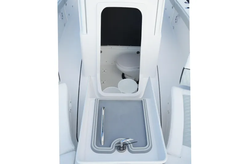 Slide: The Image of 2026 Blackfin 262 HB boat interior with sink and toilet compartment. - 68