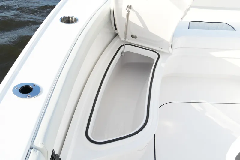 Slide: The Image of 2026 Blackfin 262 HB boat storage compartment with open lid, showcasing sleek design. - 70