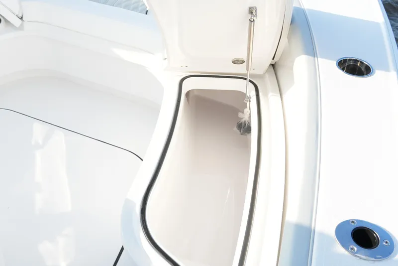 Slide: The Image of 2026 Blackfin 262 HB boat storage compartment with open hatch, showcasing sleek design. - 71