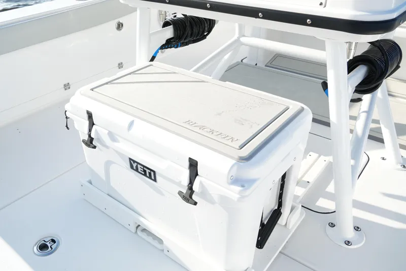 Slide: The Image of 2026 Blackfin 262 HB boat deck with Yeti cooler and storage area. - 72