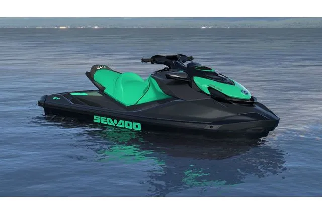 The Image of 2026 Sea-Doo GTI jet ski on calm water. - 1