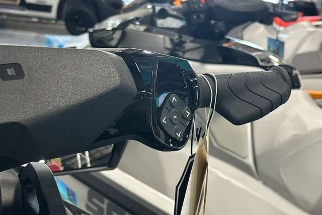 Slide: The Image of Close-up of 2026 Sea-Doo GTI handlebar controls. - 33