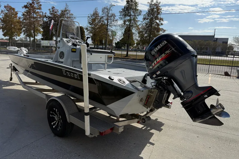 Slide: The Image of 2018 Excel 203 Bay Pro boat on trailer with Yamaha outboard motor. - 5