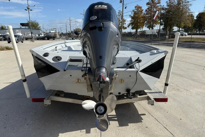 Slide: The Image of 2018 Excel 203 Bay Pro boat on trailer, rear view with outboard motor. - 6