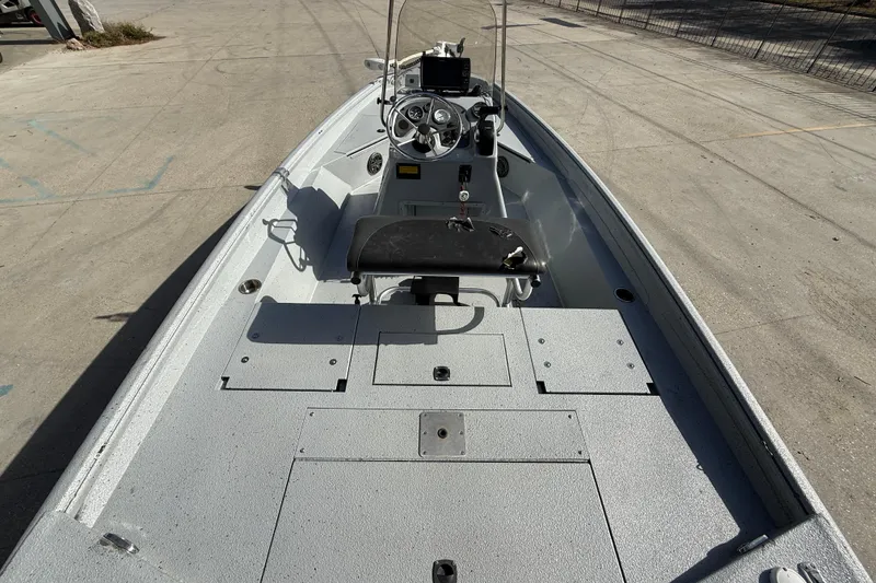 Slide: The Image of 2018 Excel 203 Bay Pro boat interior with steering console and seating. - 8