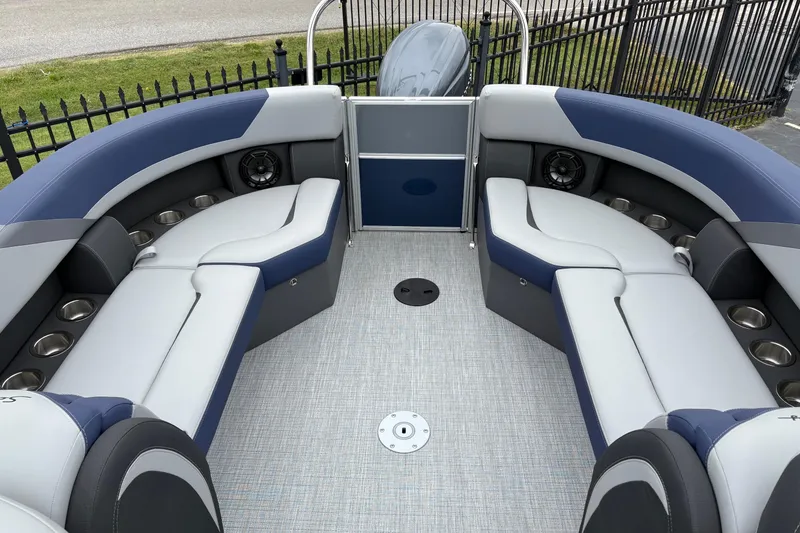 Slide: The Image of 2026 South Bay S 224 boat interior with plush seating and cup holders. - 12