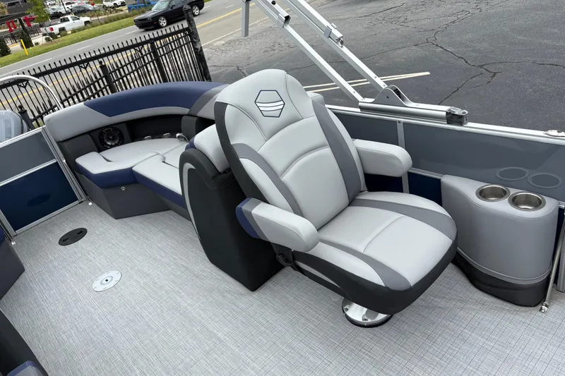 Slide: The Image of 2026 South Bay S 224 boat interior with plush seating and cup holders. - 6