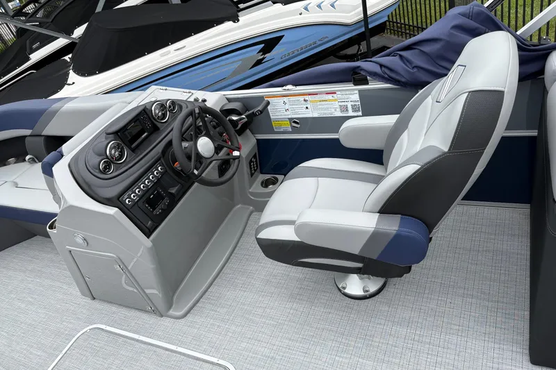 Slide: The Image of 2026 South Bay S 224 boat interior with steering console and captain's chair. - 8