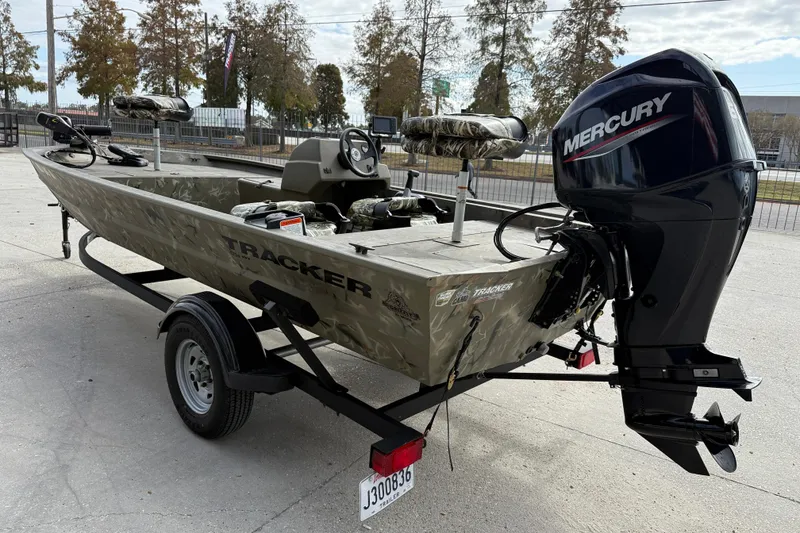 Slide: The Image of 2025 Tracker Grizzly 1754 SC boat with Mercury engine on trailer. - 5