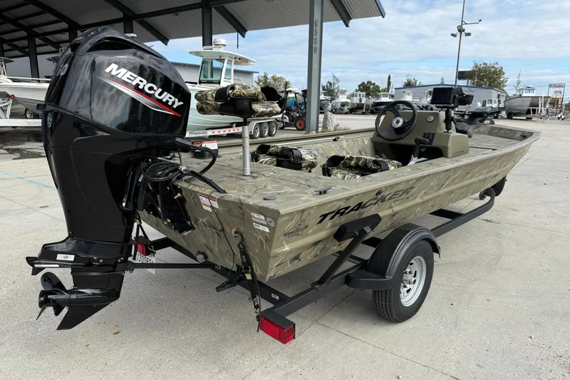 Slide: The Image of 2025 Tracker Grizzly 1754 SC boat with Mercury engine on trailer. - 7