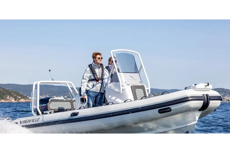 Slide: The Image of Manufacturer Provided Image: 2025 Highfield Sport 560 boat cruising on open water. - 2