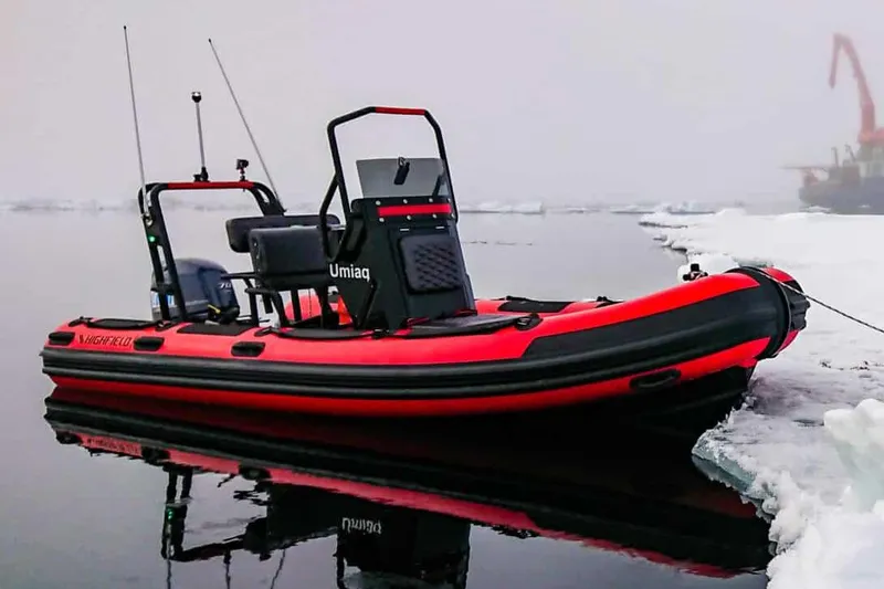 The Image of Manufacturer Provided Image: 2025 Highfield Patrol 500 boat in icy waters, vibrant red and black design. - 0