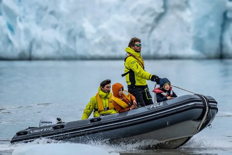 Slide: The Image of Manufacturer Provided Image: Highfield Patrol 420 boat navigating icy waters with passengers, 2025 model. - 2