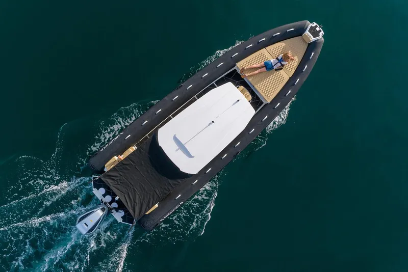 Slide: The Image of Manufacturer Provided Image: Aerial view of 2025 Highfield Sport 800 boat cruising on water. - 2