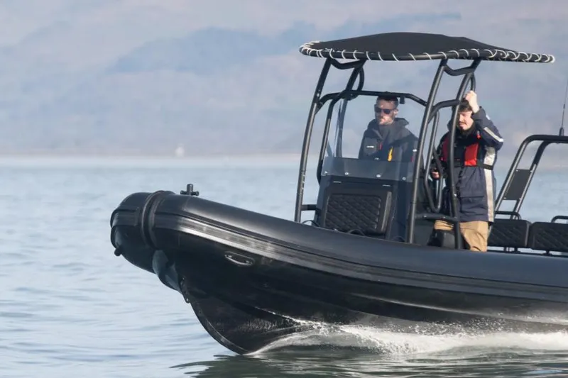 Slide: The Image of Manufacturer Provided Image: 2025 Highfield Patrol 660 boat cruising on calm water. - 5