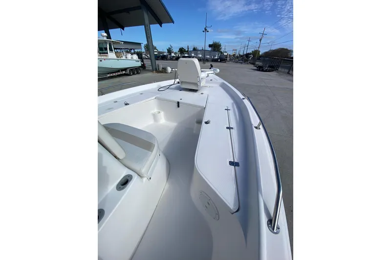 Slide: The Image of 2006 Sea Quest 2100 Probay boat, white deck, outdoor setting, clear sky. - 11