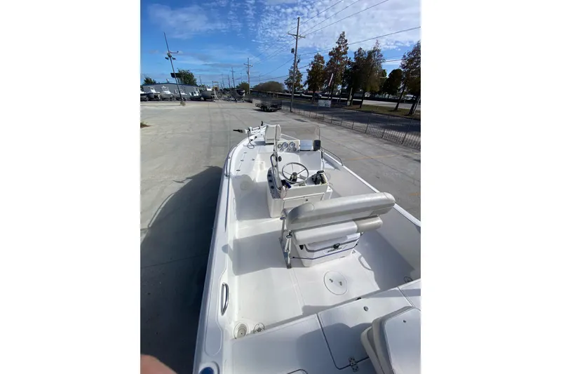 Slide: The Image of 2006 Sea Quest 2100 Probay boat with spacious deck and steering console. - 15