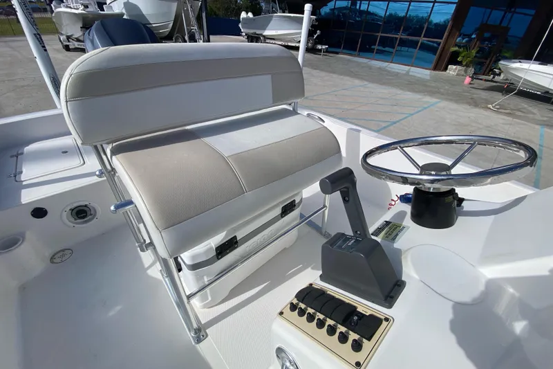 Slide: The Image of 2006 Sea Quest 2100 Probay boat interior with steering wheel and control panel. - 17