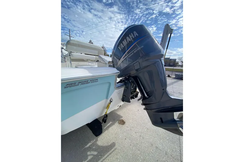 Slide: The Image of 2006 Sea Quest 2100 Probay boat with Yamaha outboard motor under a blue sky. - 21