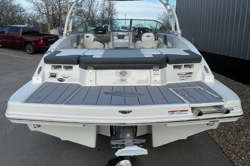 Slide: The Image of 2023 Chaparral 23 SSi boat, rear view with swim platform and seating. - 3
