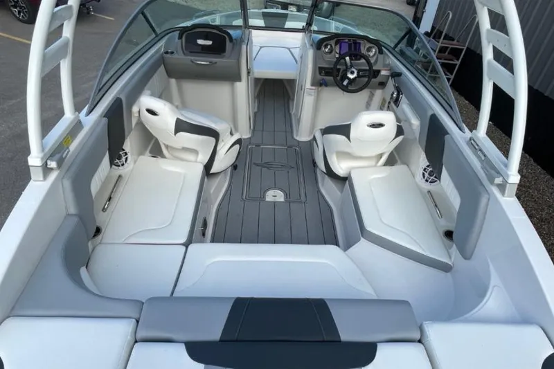 Slide: The Image of 2023 Chaparral 23 SSi boat interior with modern seating and steering console. - 4