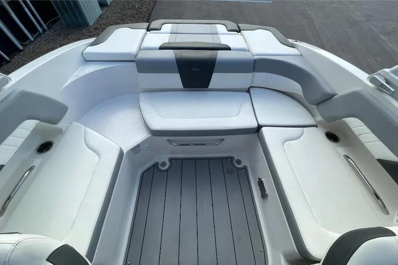 Slide: The Image of 2023 Chaparral 23 SSi boat interior with white and gray seating. - 5