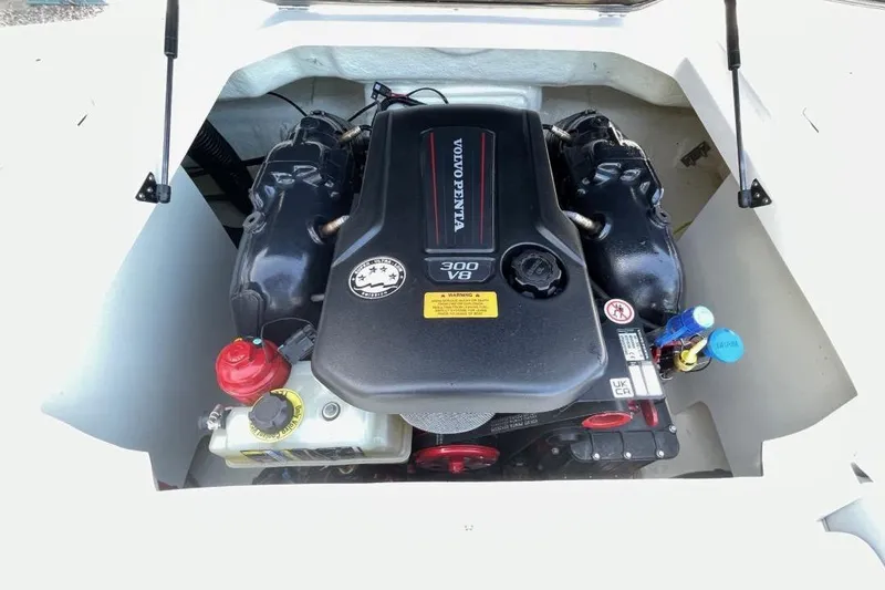 Slide: The Image of 2023 Chaparral 23 SSi boat engine, Volvo Penta 300 V8, in open compartment. - 7