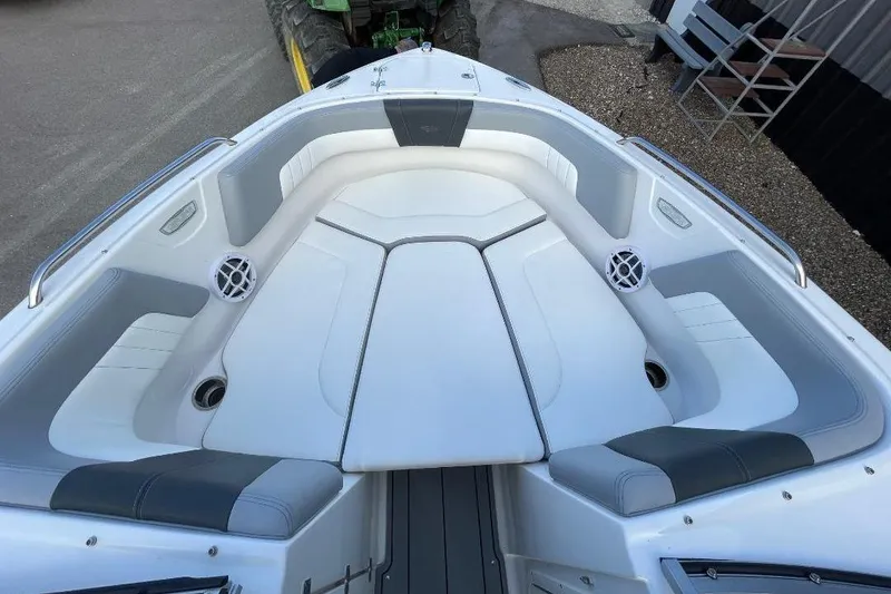 Slide: The Image of 2023 Chaparral 23 SSi boat interior with white and gray seating. - 9