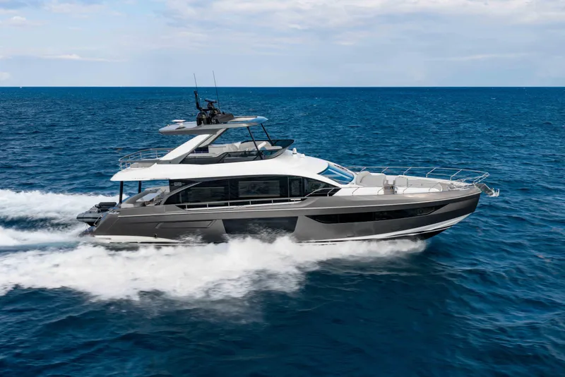 The Image of 2024 Azimut Fly 68 yacht cruising on open sea, side view. - 1