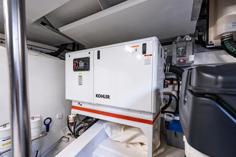 Slide: The Image of Engine room of 2024 Azimut Fly 68 yacht featuring a Kohler generator. - 17