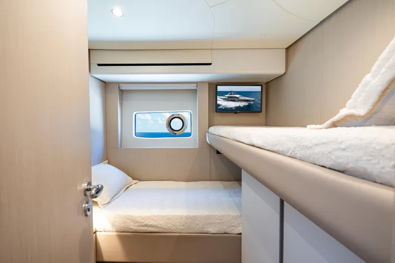 Slide: The Image of 2024 Azimut Fly 68 yacht cabin with cozy beds and ocean view. - 20