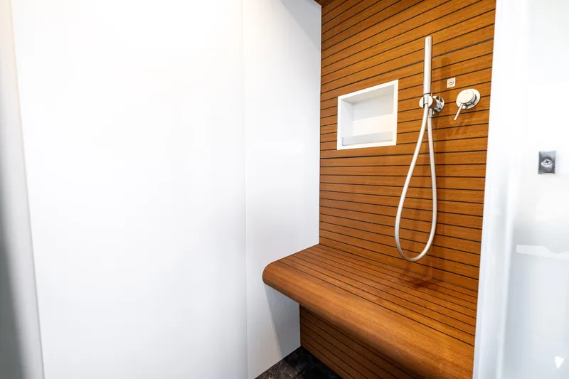 Slide: The Image of Luxurious shower area in 2024 Azimut Fly 68 yacht with wooden accents. - 27