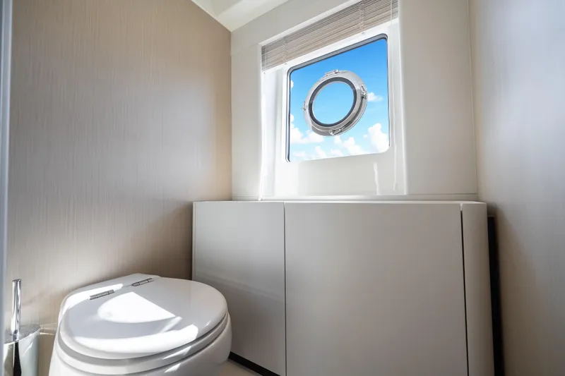 Slide: The Image of Luxurious bathroom interior of 2024 Azimut Fly 68 yacht with porthole view. - 29